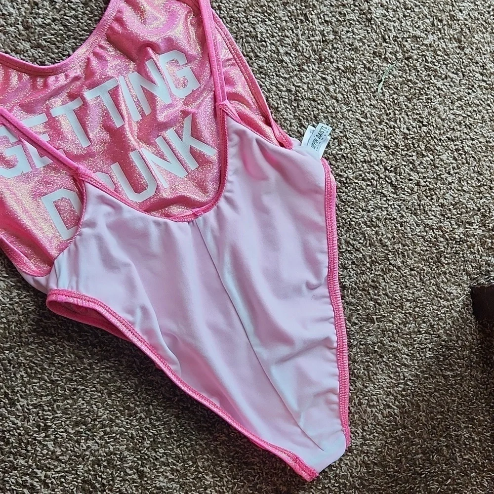 DIPPIN DAISY’S pink glitter Getting Drunk one-piece swimsuit
